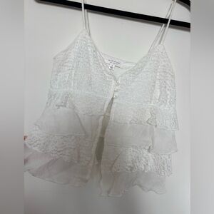 Kirious white tank top with open feature and cute ruffles